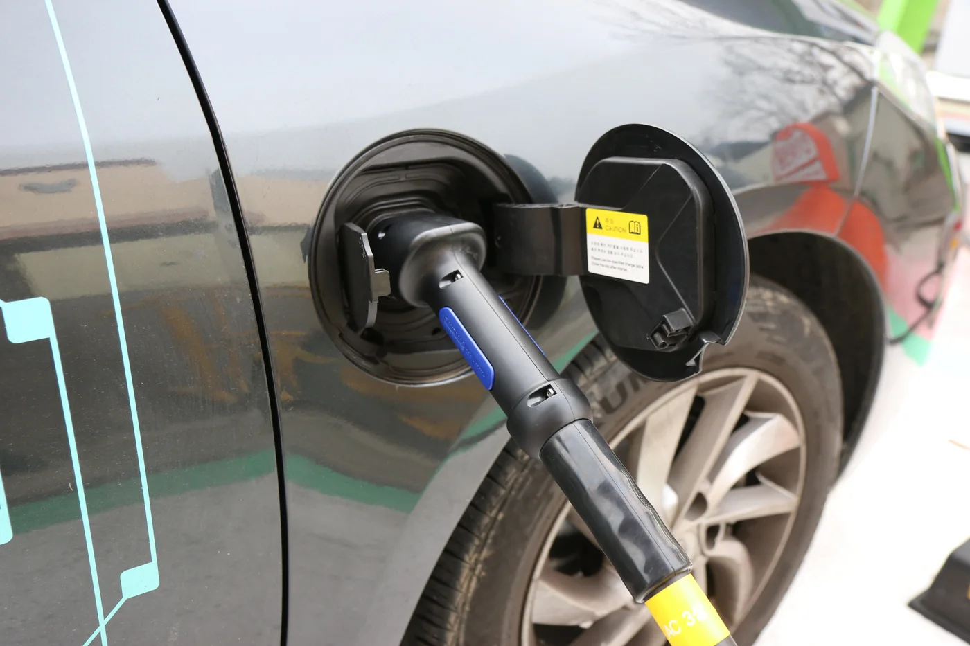 Charging cable plugged into an electric car