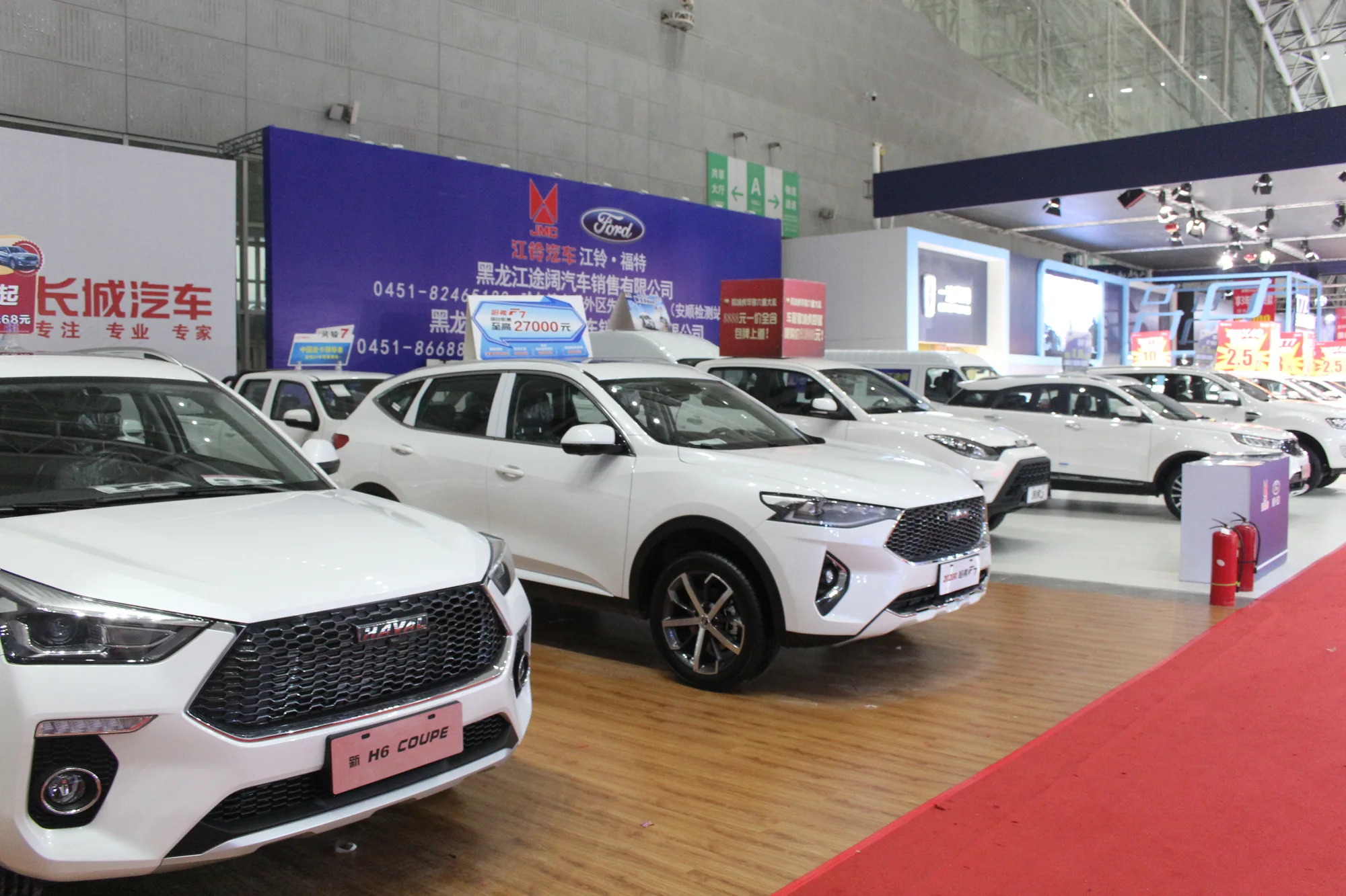 Bright vehicle showroom with SUVs on display