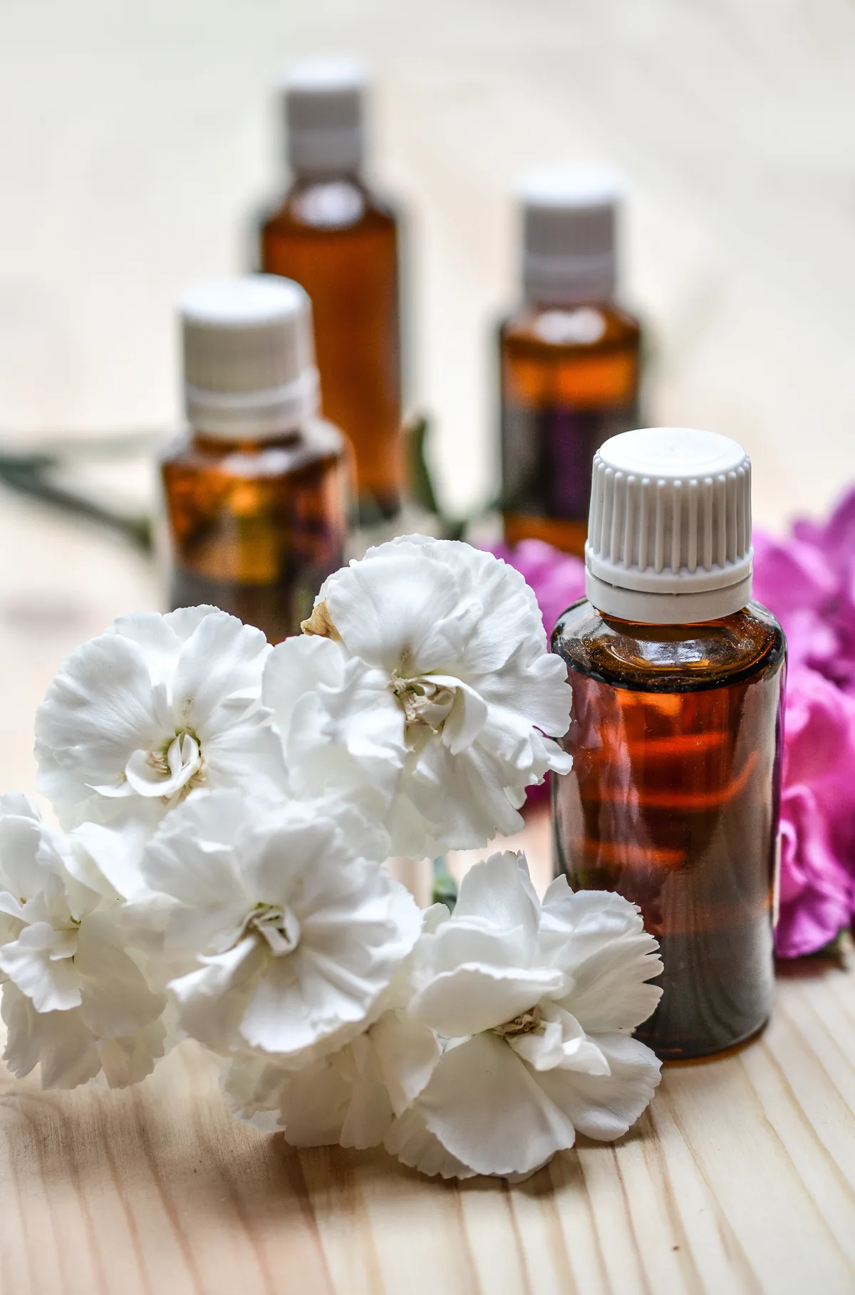Amber bottles and white flowers