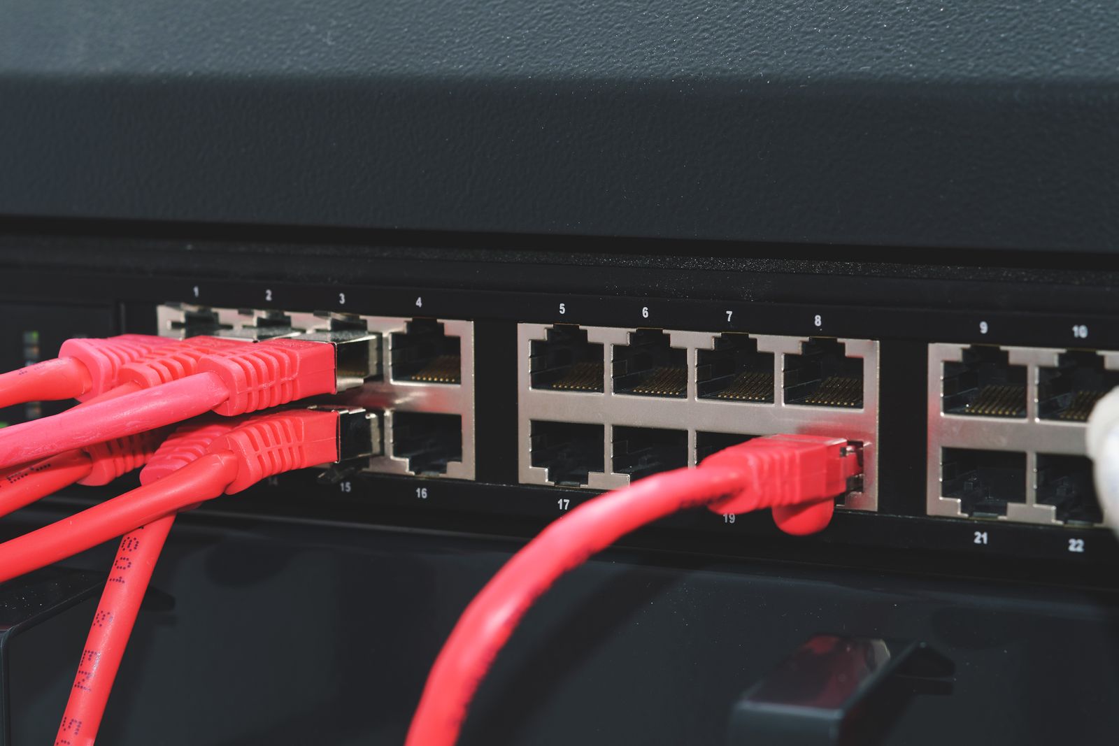 Network switch with red patch cables connected