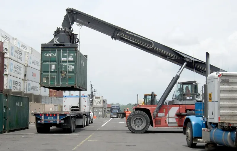 Reach stacker lifting a container