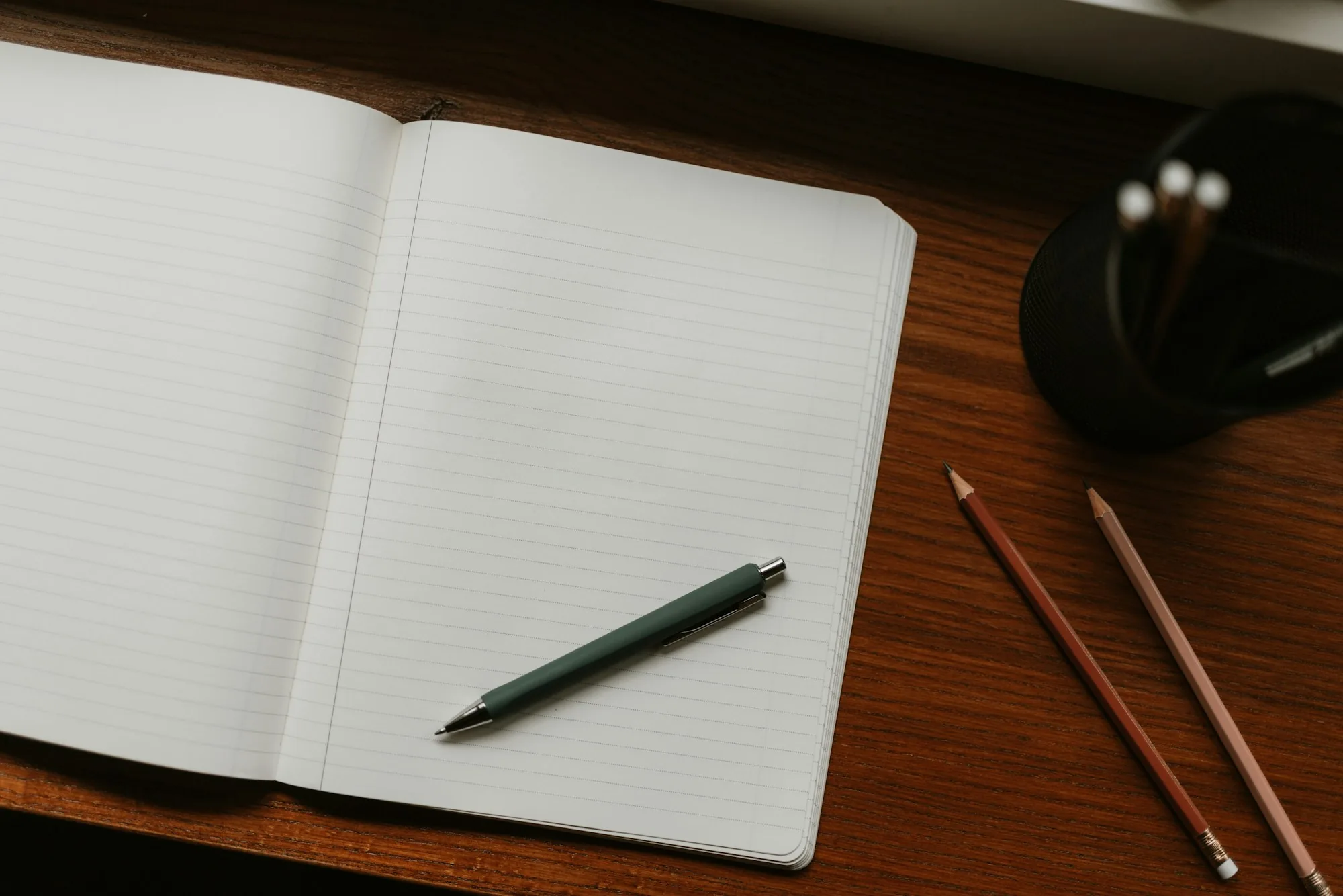 Notebook and pen on a desk