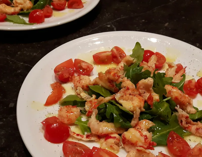 A plated salad on a white plate
